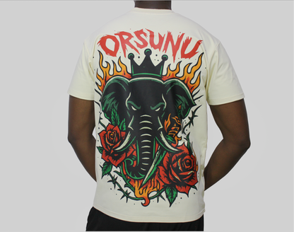 A cream t-shirt with an elephant design and 'ORSUNU' text on the back.