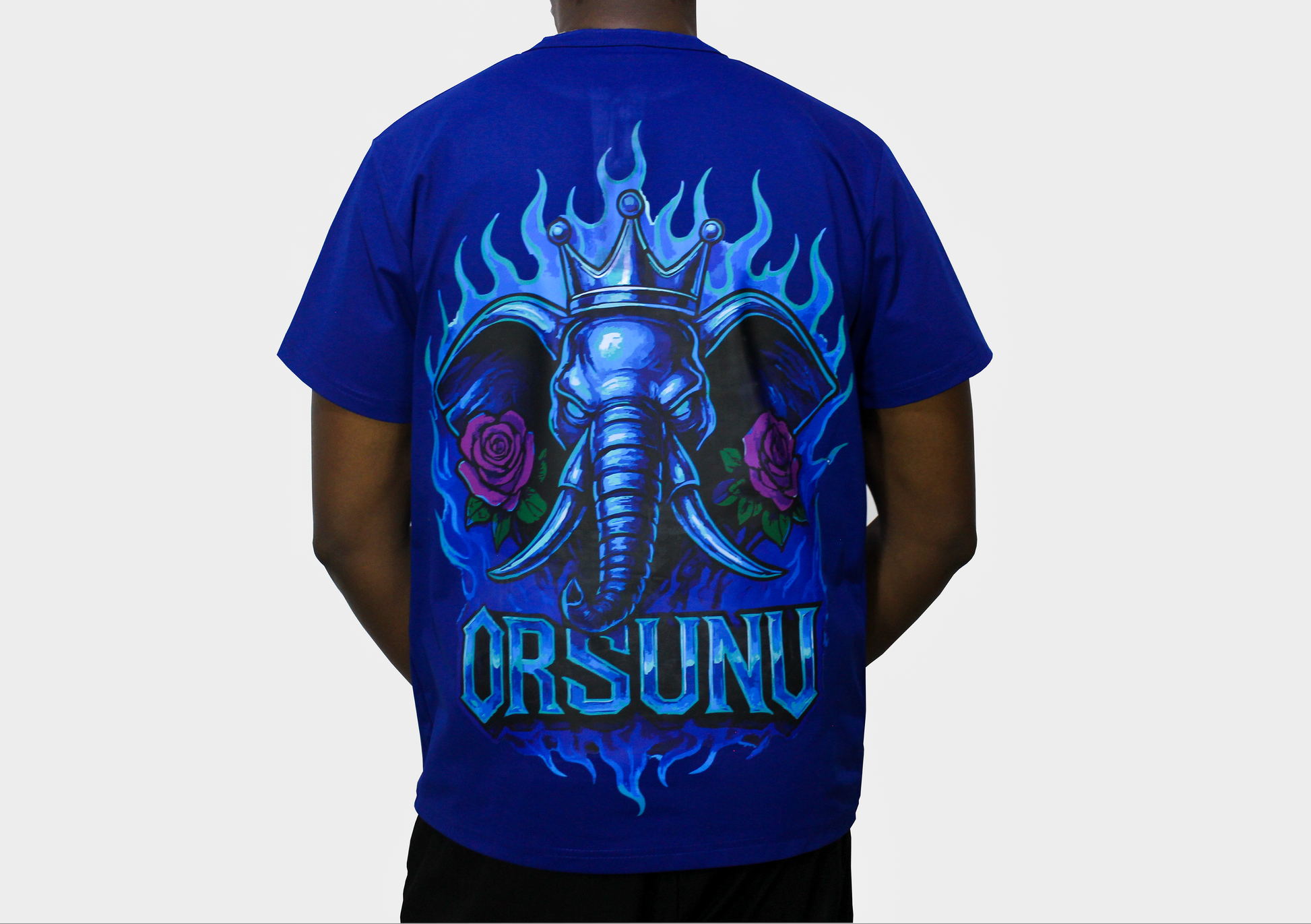 Blue t-shirt with blue fire a colourful design on the back and 'Orsunu' text, .